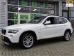 BMW X1 - SDrive18i Executive Navigatie PDC * 106.292km - 1 - Thumbnail