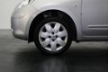 Nissan Micra - 1.2 Acenta Automaat | Airco | Radio-CD/MP3 Speler | Bluetooth Tel. | Armsteun Voor | - 1 - Thumbnail