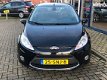 Ford Fiesta - 1.25 82PK Titanium X-pack Navigatie | Cruise | Clima | Trekhaak | All-season banden | - 1 - Thumbnail