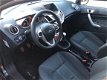 Ford Fiesta - 1.25 82PK Titanium X-pack Navigatie | Cruise | Clima | Trekhaak | All-season banden | - 1 - Thumbnail