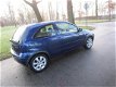 Opel Corsa - 1.4-16V Full Rhythm airco.elelectr.ramen.stuurbekr.deurvergrendelng.lm.wielen - 1 - Thumbnail