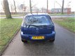 Opel Corsa - 1.4-16V Full Rhythm airco.elelectr.ramen.stuurbekr.deurvergrendelng.lm.wielen - 1 - Thumbnail