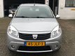 Dacia Sandero - 1.2 Lauréate Airco/ 5Dr/ El.raam/ NAP/ APK - 1 - Thumbnail