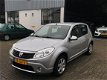 Dacia Sandero - 1.2 Lauréate Airco/ 5Dr/ El.raam/ NAP/ APK - 1 - Thumbnail