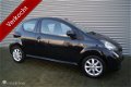 Toyota Aygo - 1.0-12V 3DRS AIRCO LMV ELL PAK ..111.156KM - 1 - Thumbnail