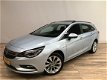 Opel Astra Sports Tourer - 1.0 Turbo Edition OPEN DAK / NAVI / PDC V+A / CLIMA / LMV / LED DAGRIJVER - 1 - Thumbnail