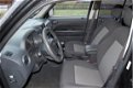 Jeep Patriot - 2.4 Sport Liberty 4x4 Autotel. Getint glas Cruise Control - 1 - Thumbnail