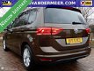 Volkswagen Touran - 1.2 TSI Comfortline 7persoons NAVI/PDC/CRUISE C./STOELVW/TREKHAAK/ETC - 1 - Thumbnail