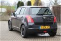 Suzuki Swift - 1.3 Base | Airco - recent grote beurt gehad - 1 - Thumbnail