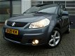 Suzuki SX4 - 1.6 SHOGUN MPV HOGE INSTAP AIRCO CARKIT DAKRAIL LICHTMETALEN VELGEN TREKHAAK - 1 - Thumbnail