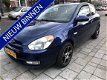 Hyundai Accent - 1.4i Dynamic met airco en stuurbekr - 1 - Thumbnail