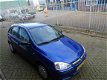 Opel Corsa - 1.0-12V Rhythm 5 deurs automaat Cruise contr, - 1 - Thumbnail