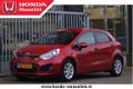 Kia Rio - 1.2 CVVT Comfort Pack - All-in prijs | airco - 1 - Thumbnail