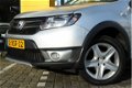 Dacia Sandero - TCe 90 Stepway Lauréate 33.000KM / AIRCO / NAVI / PDC / CRUISE / 1E EIGENAAR - 1 - Thumbnail