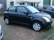 Suzuki Swift - 1.3 Comfort - 1 - Thumbnail