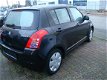 Suzuki Swift - 1.3 Comfort - 1 - Thumbnail