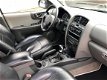 Hyundai Santa Fe - 2.0i-16V Dynamic Motion UNIEK -MAT ZWART - 1 - Thumbnail