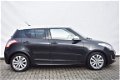 Suzuki Swift - 1.2 EXCLUSIVE EASSS TWO-TONE - AIRCO - CRUISE CONTROL - 1 - Thumbnail