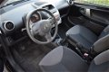 Citroën C1 - 1.0 Attraction 68PK 5drs 1e eig met airco en radio cd speler en parrot bluetooth - 1 - Thumbnail