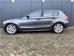 BMW 1-serie - 120d Graphite LEER airco LMV NAVIGATIE BOMVOL - 1 - Thumbnail