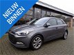 Hyundai i20 - 1.4i i-Vision 101PK LED/CRUISE C./TEL - 1 - Thumbnail