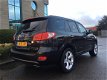 Hyundai Santa Fe - 2.7i V6 4WD Style 7p. LPG/AUTOMAAT/ELEK.RAMEN.SPIEGELS/7-ZITS/LMV/LEDER/NAP/NAVI/ - 1 - Thumbnail