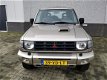 Mitsubishi Pajero - 2.8 GLS High Roof Lage kilometers Airco cruise control - 1 - Thumbnail