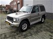 Mitsubishi Pajero - 2.8 GLS High Roof Lage kilometers Airco cruise control - 1 - Thumbnail