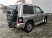 Mitsubishi Pajero - 2.8 GLS High Roof Lage kilometers Airco cruise control - 1 - Thumbnail