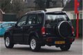 Suzuki Grand Vitara - 2.0 FreeStyle-3 4WD Automaat | Leer | onderh. hist. | -All-in prijs | Trekhaak - 1 - Thumbnail