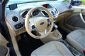 Ford Fiesta - 1.25 Ghia 5 Deurs, Airco, NL Auto, Navi - 1 - Thumbnail