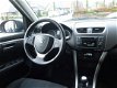 Suzuki Swift - 1.2 EXCLUSIVE STOP en START CLIMA/CRUISE/PDC - 1 - Thumbnail