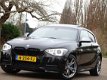 BMW 1-serie - M135i 319PK+ High Executive 2014 M-Perf - 1 - Thumbnail