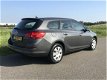 Opel Astra Sports Tourer - 1.4 Anniversary Ed. 2012 met Navi/Airco/Elek pakket - 1 - Thumbnail