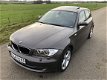 BMW 1-serie - 118i High Executive LEDER | XENON | NAVI | SCHUIFDAK | PDC | - 1 - Thumbnail