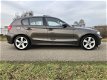 BMW 1-serie - 118i High Executive LEDER | XENON | NAVI | SCHUIFDAK | PDC | - 1 - Thumbnail