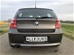 BMW 1-serie - 118i High Executive LEDER | XENON | NAVI | SCHUIFDAK | PDC | - 1 - Thumbnail
