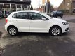 Volkswagen Polo - 1.2 TSI Highline Airco, Cruise, 16'' Lichtm. velg - 1 - Thumbnail