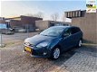 Ford Focus Wagon - 1.0 EcoBoost Titanium navigatie cruise control airco ecc pdc trekhaak - 1 - Thumbnail