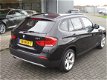 BMW X1 - 2.0 16V SDRIVE NAVI (occasion) ruisecontrol , Clima, PDC, Roofrails, 18 Inch Velgen - 1 - Thumbnail