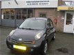 Nissan Micra - 1.2 Tekna 5DRS-STRB-ZWART-BJ 05-2003-APK 05-2020 - 1 - Thumbnail