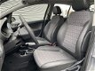 Opel Corsa - 1.4 16v Cosmo Automaat 1ste eig., Navig., Airco, Park. sens., Lichtm. velg - 1 - Thumbnail
