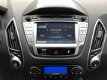 Hyundai ix35 - 2.0i 165pk i-Catcher Automaat Glazen dak, Leer, Camera, Navig., Climate, Cruise, 18'' - 1 - Thumbnail