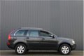 Volvo XC90 - 2.4 D5 Summum AUTOMAAT / NAVI / LEDER - 1 - Thumbnail