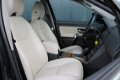 Volvo XC90 - 2.4 D5 Summum AUTOMAAT / NAVI / LEDER - 1 - Thumbnail