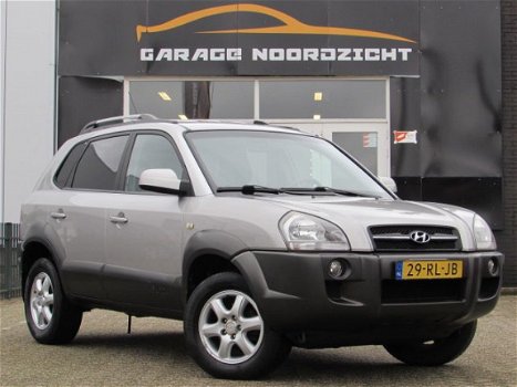 Hyundai Tucson - 2.0i 141PK Dynamic AIRCO|CRUISE CONTROL|GETINT GLAS|PDC ACHTER|LM-VELGEN - 1