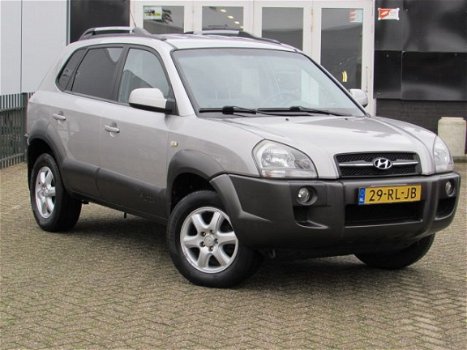 Hyundai Tucson - 2.0i 141PK Dynamic AIRCO|CRUISE CONTROL|GETINT GLAS|PDC ACHTER|LM-VELGEN - 1