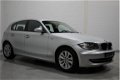 BMW 1-serie - 118i Business Line 143 pk, Airco, Cruise, Multifunctioneel stuur, Regensensor, NL auto - 1 - Thumbnail