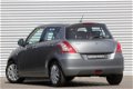 Suzuki Swift - 1.2 Comfort Automaat | Airco | PDC | Navi Actie | 5 Deurs - 1 - Thumbnail