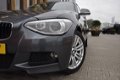 BMW 1-serie - 114i EDE Executive Parkeersensoren voor/achter | navi | Acc - 1 - Thumbnail